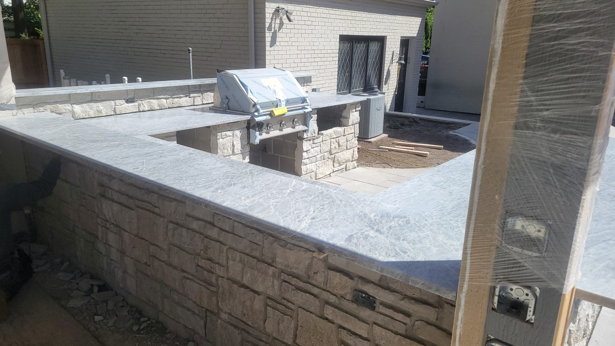 Outdoor Kitchen with Natural Stone Countertops in Chicago